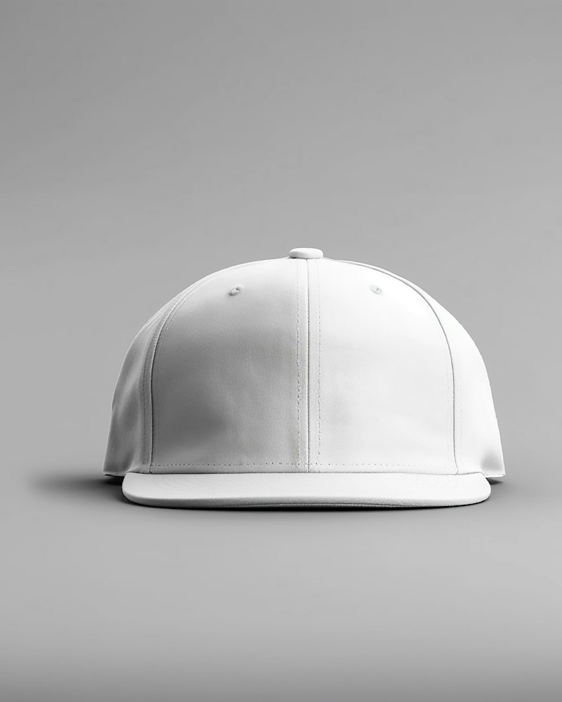 A plain white baseball cap on a gray background